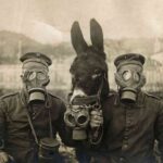 Two soldiers in World War I wearing masks with their quadrupeds waiting for a chemical attack.