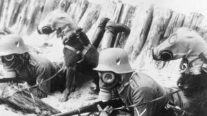 Two German soldiers wearing masks during a battle in northern Germany with their dogs