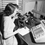 A working computer with a microscope and a Friedan calculator